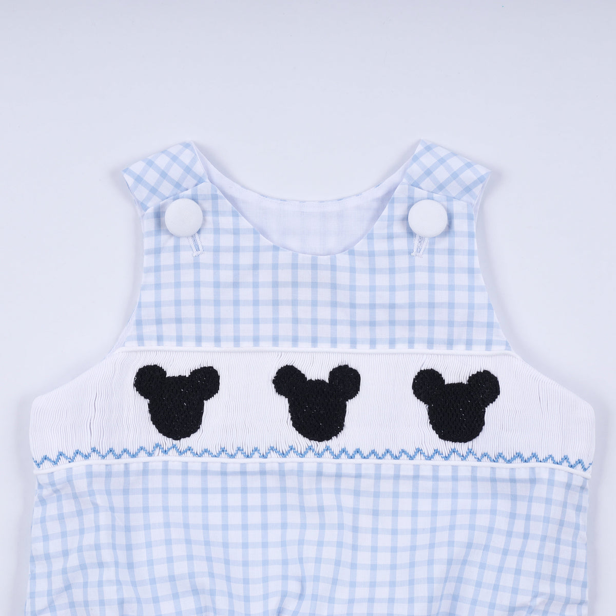 Blue character hand smocked gingham bubble