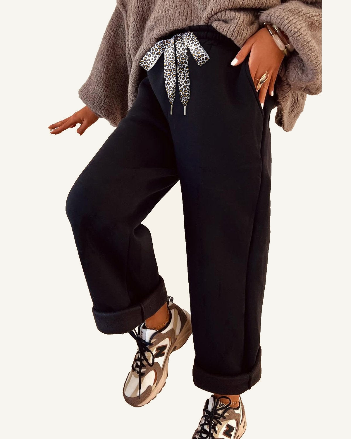 Black Fleece Lined Leopard Drawstring Elastic Waist Solid Pants — ivory studio background