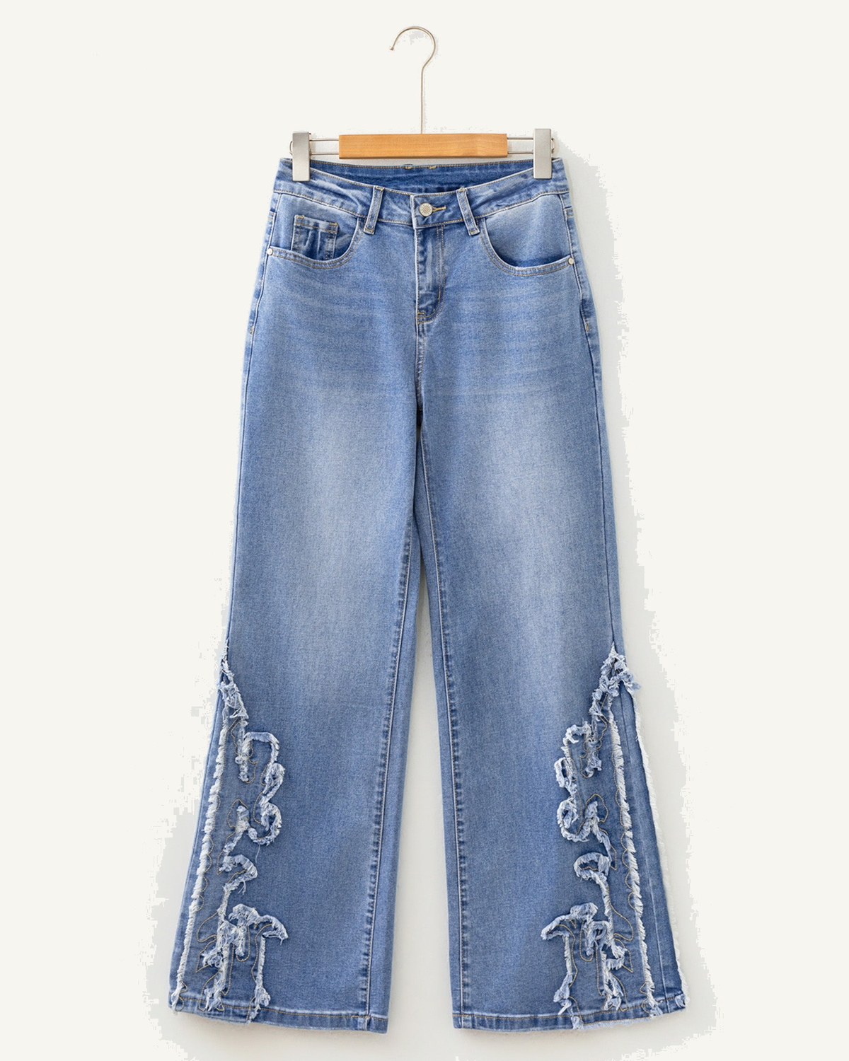 Ashleigh Blue Embroidered Western Print Flare Leg Full Length Jeans — ivory studio background